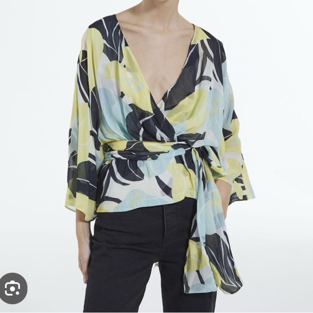 Brand new Kimono flowing top with floral print and tie.